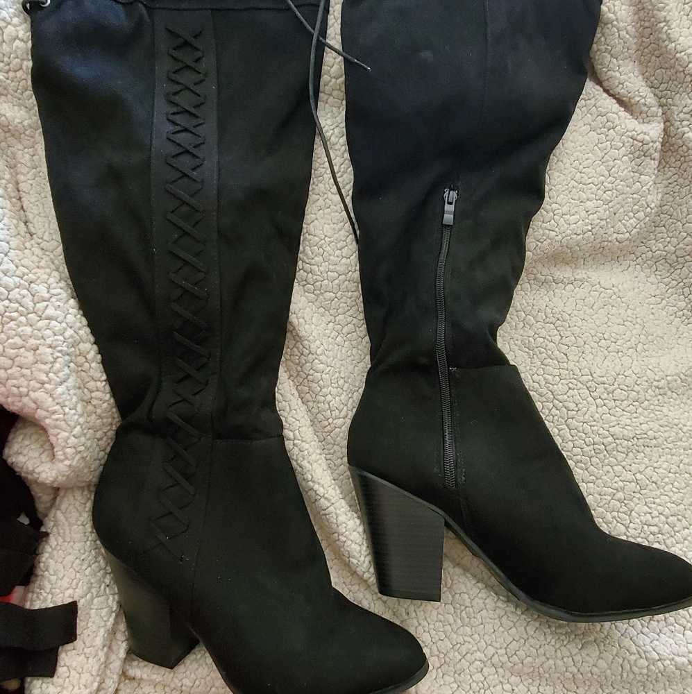 Black knee high heeled boots